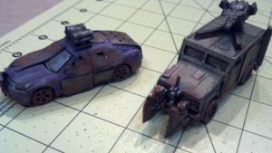 A medium car with rocket launchers and a heavy armored car with a heavy ram and a gun turret